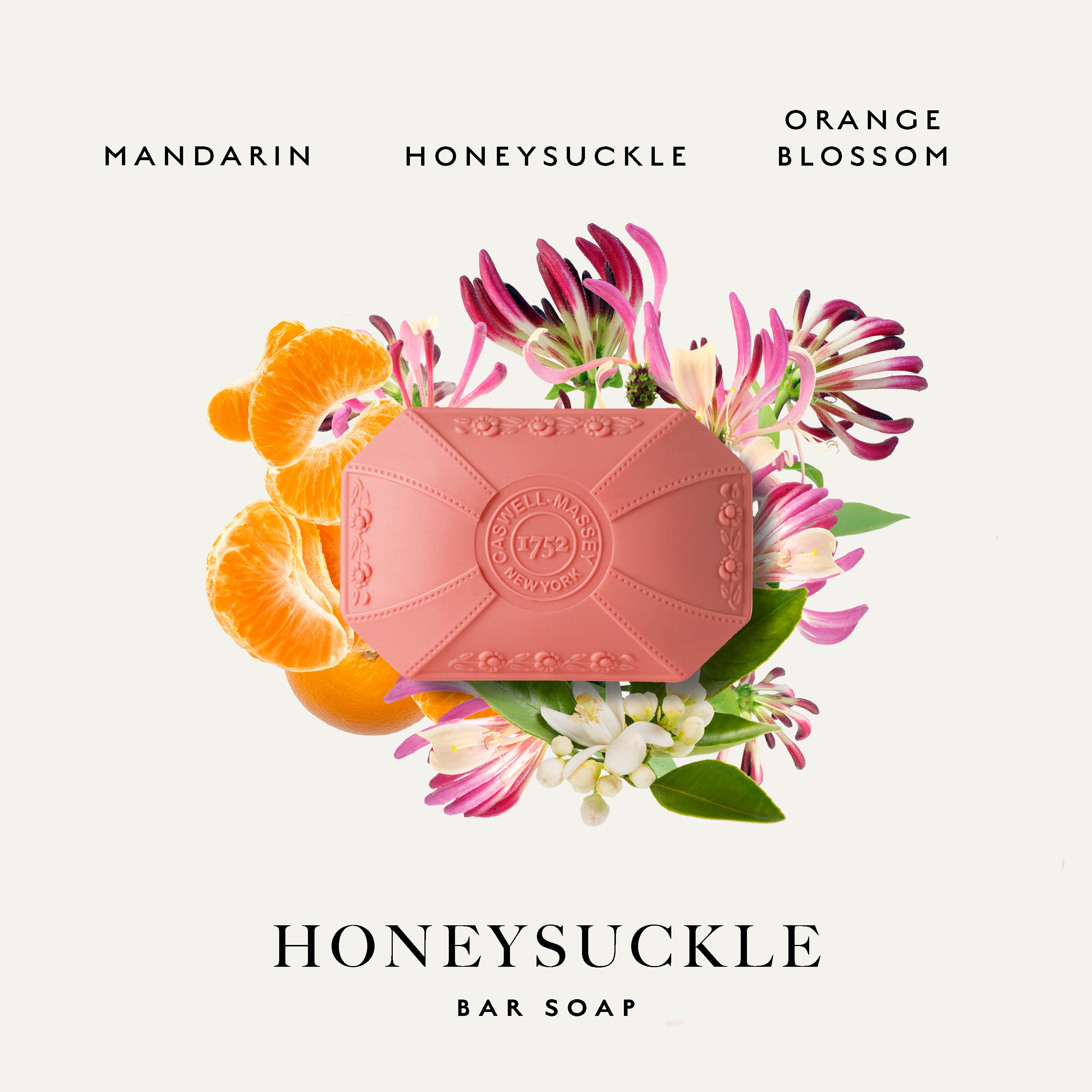 A pink bar of Caswell-Massey Honeysuckle Bar Soap centered on a light cream background, surrounded by orange slices, pink and white blossoms, and green leaves. Text at the top reads 'MANDARIN HONEYSUCKLE ORANGE BLOSSOM' and text at the bottom reads 'HONEYSUCKLE BAR SOAP'.