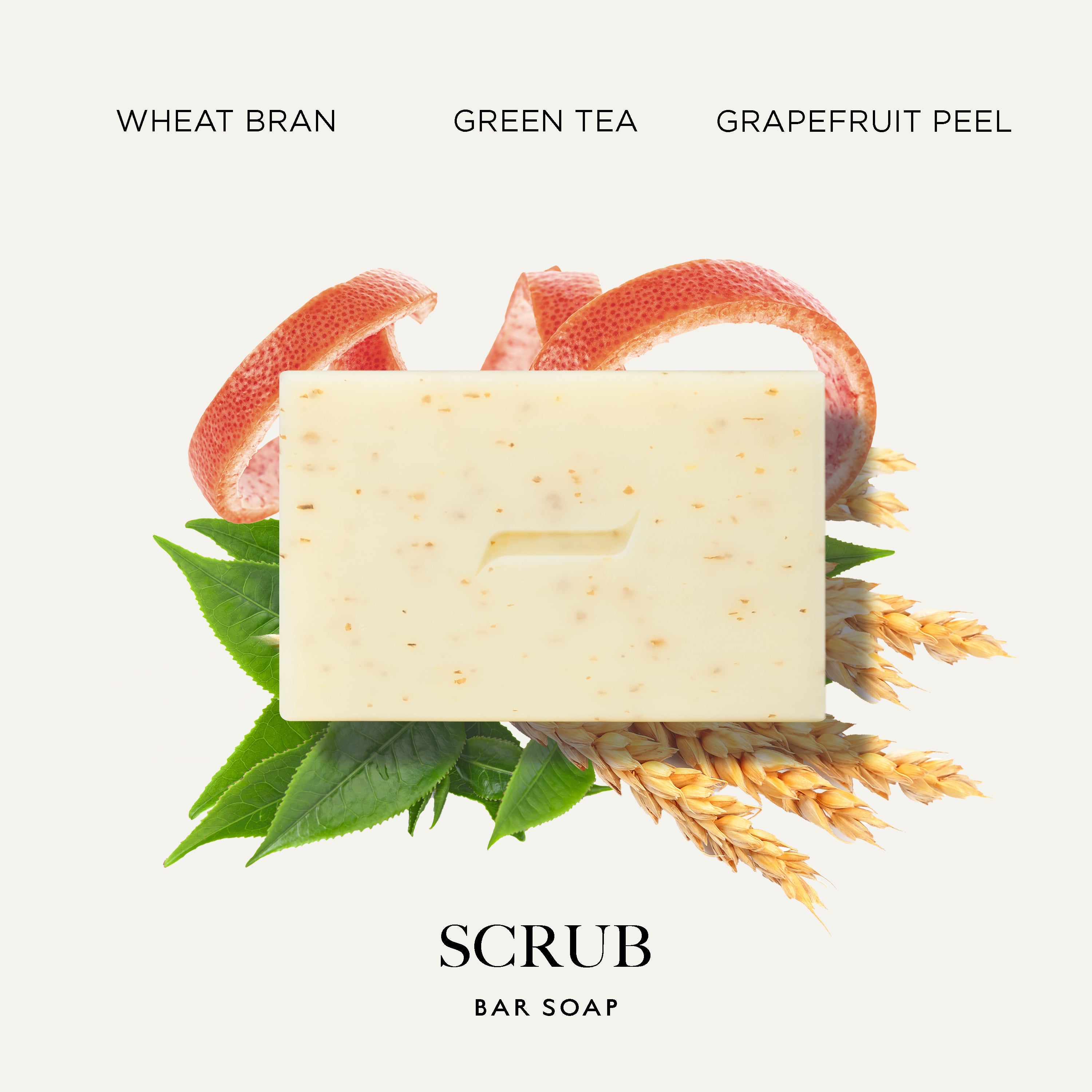 A rectangular Caswell-Massey Body Scrub Soap bar of creamy off-white scrub with small speckles, centered on a light beige background with ingredient graphics including wheat bran, green tea leaves, grapefruit peel slices, and wheat stalks. Text at the top reads 'WHEAT BRAN GREEN TEA GRAPEFRUIT PEEL' and the bottom reads 'SCRUB BAR SOAP'.