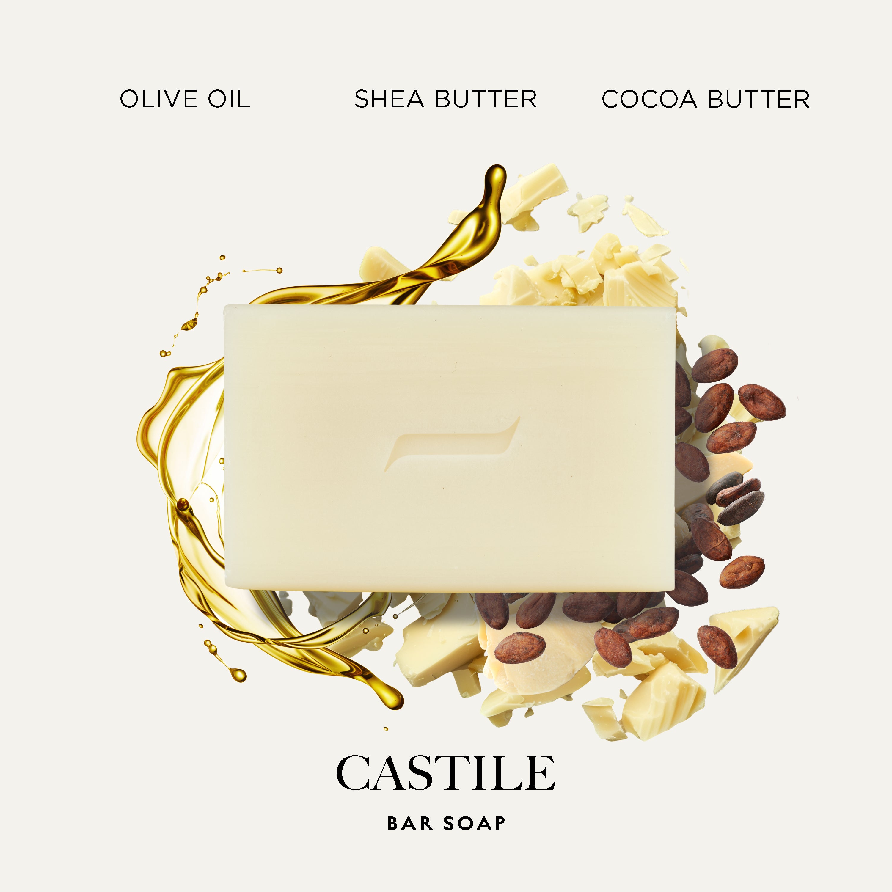A rectangular Caswell-Massey Castile bar soap in a warm cream color, centered on a light beige background. The soap is artistically surrounded by golden olive oil splashes, white shea butter chunks, cocoa butter pieces, and cocoa beans.