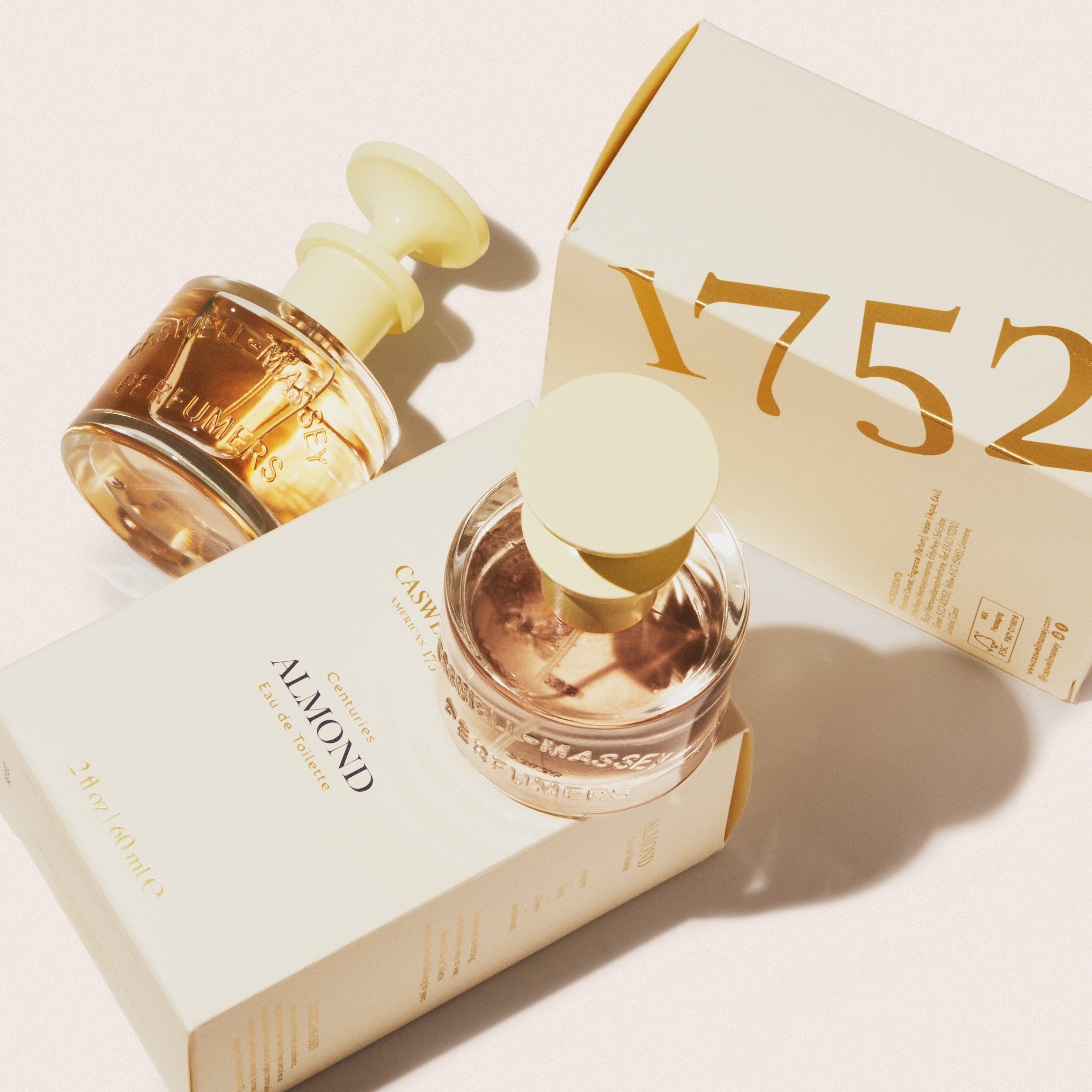 Caswell-Massey Almond Eau de Toilette: Full-Size Fragrance bottle sitting on top of outer packaging (cream box with gold lettering)