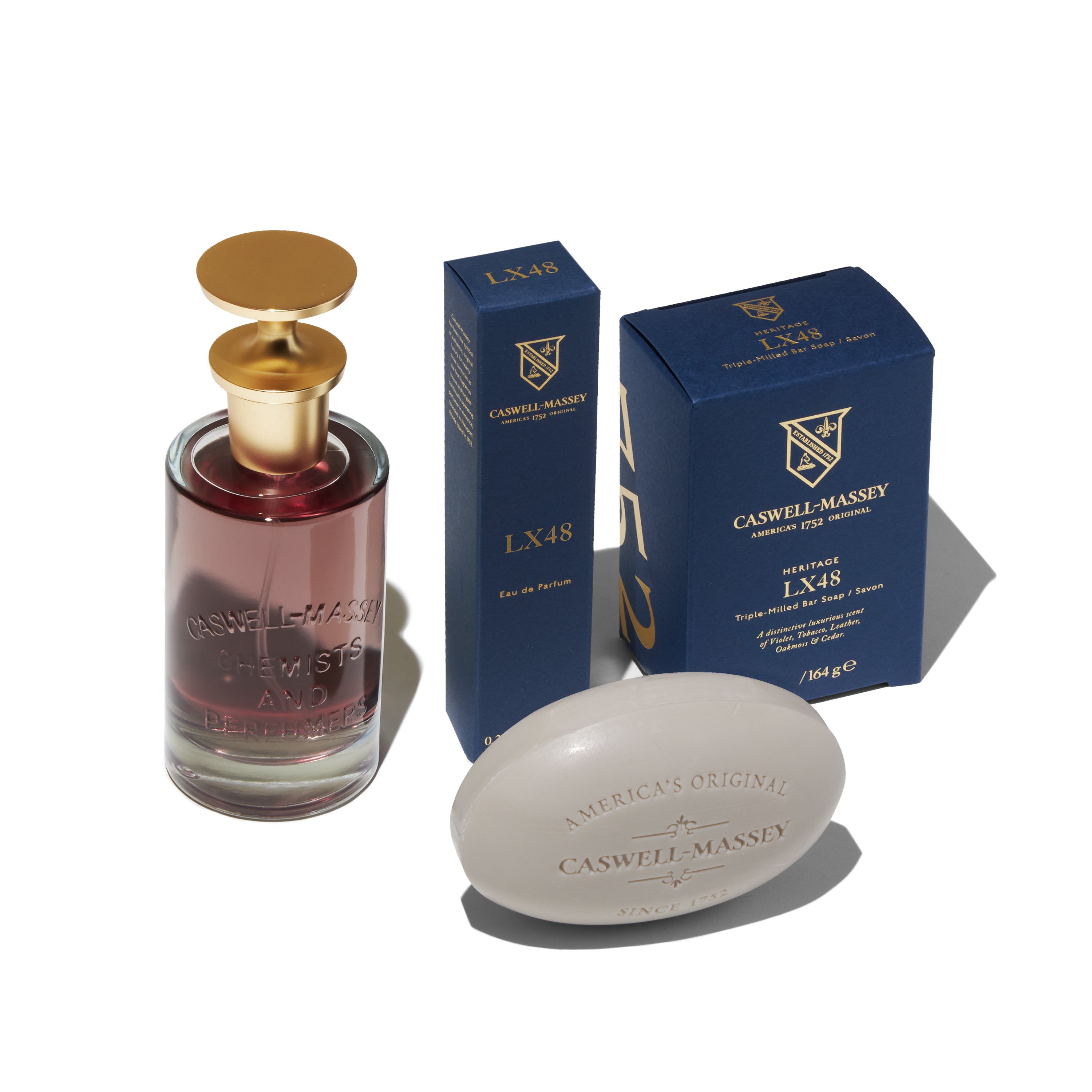 Caswell-Massey LX48 Eau de Parfum showing the full-size 100ml, the travel-size 7.5ml, and the LX48 Bar Soap
