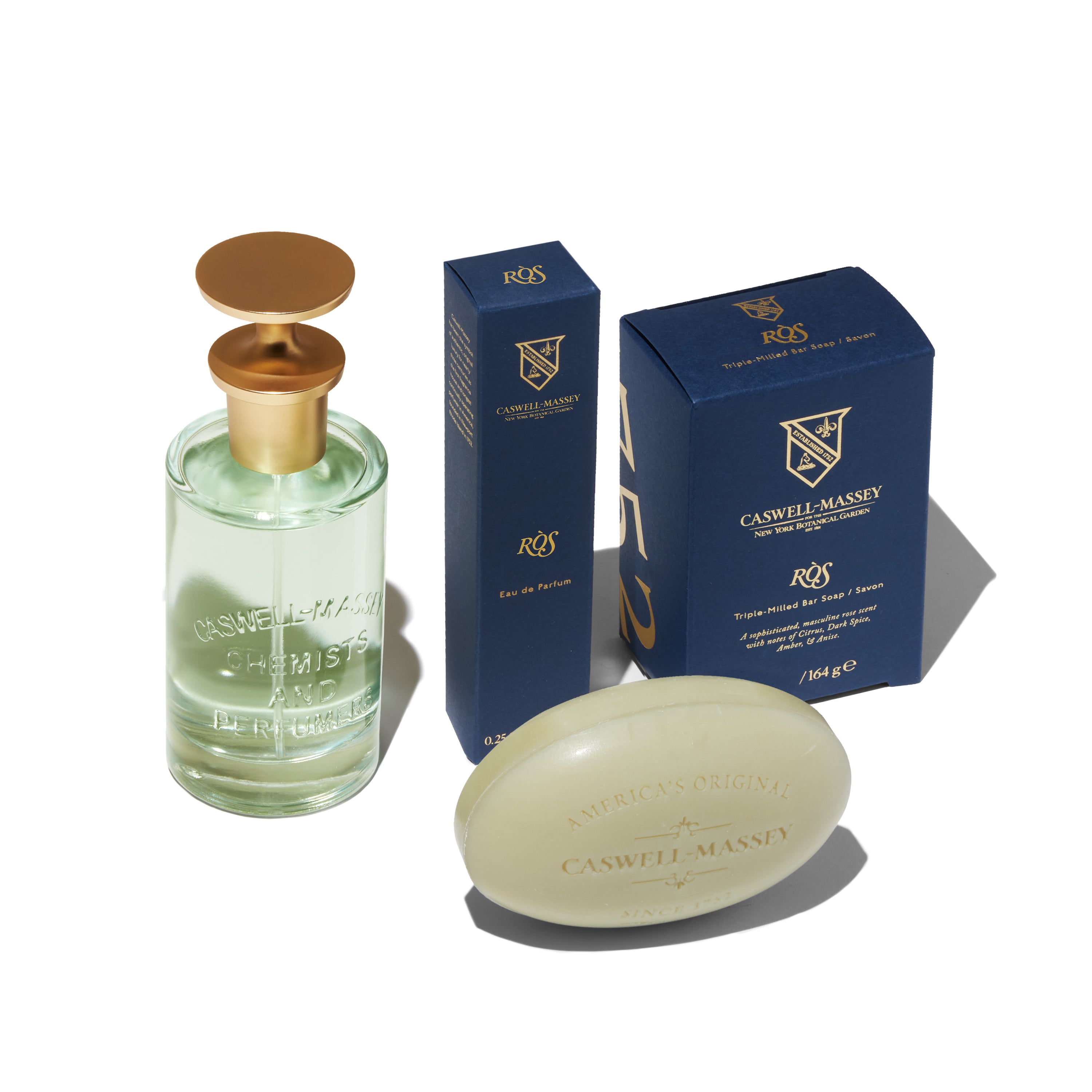 Caswell-Massey RÒS Eau de Parfum showing full-size 100ml, travel-size 7.5ml, and RÒS Bar Soap