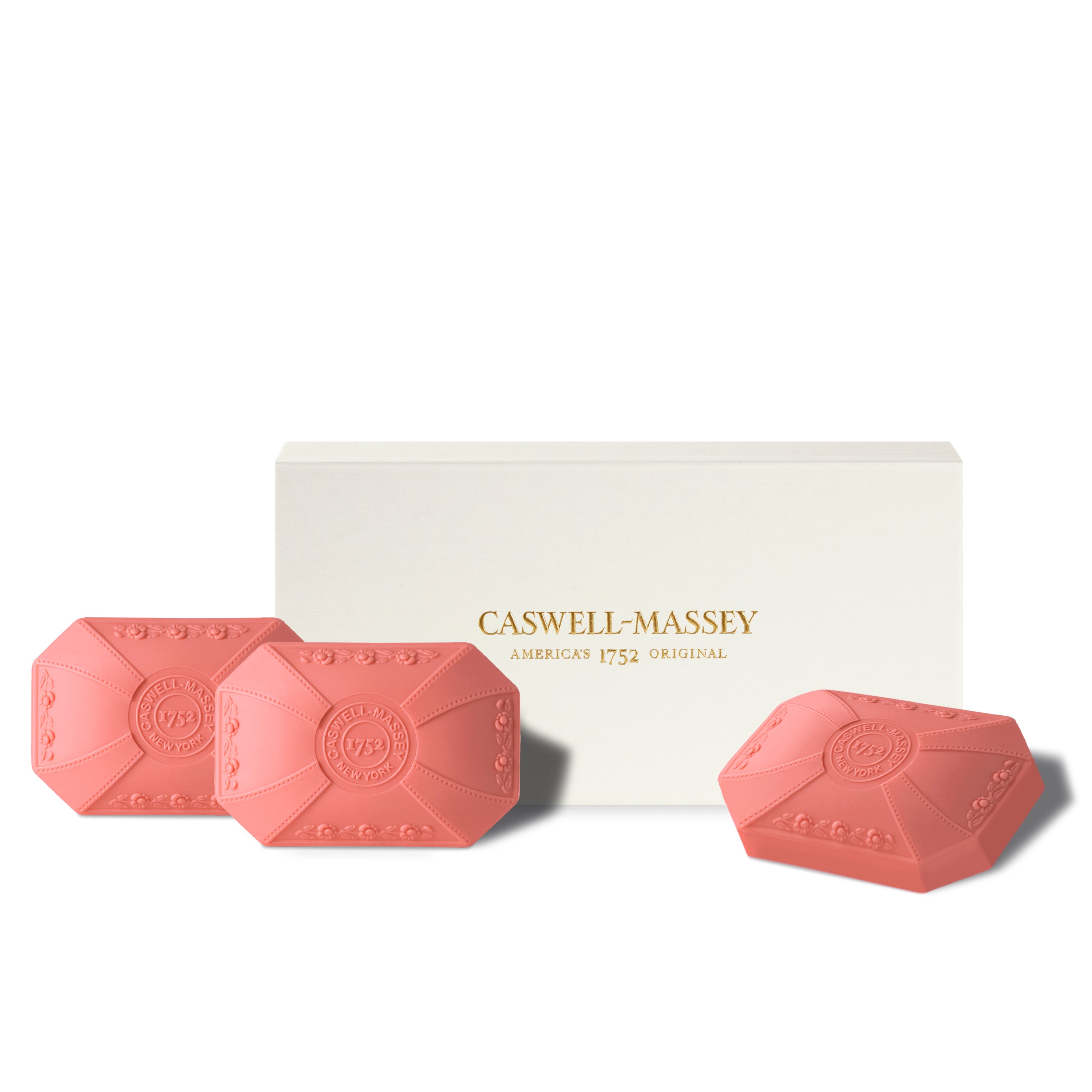 Caswell-Massey Honeysuckle Luxury 3-Soap Gift Set shown with gift box alongside pink decorative bath soaps