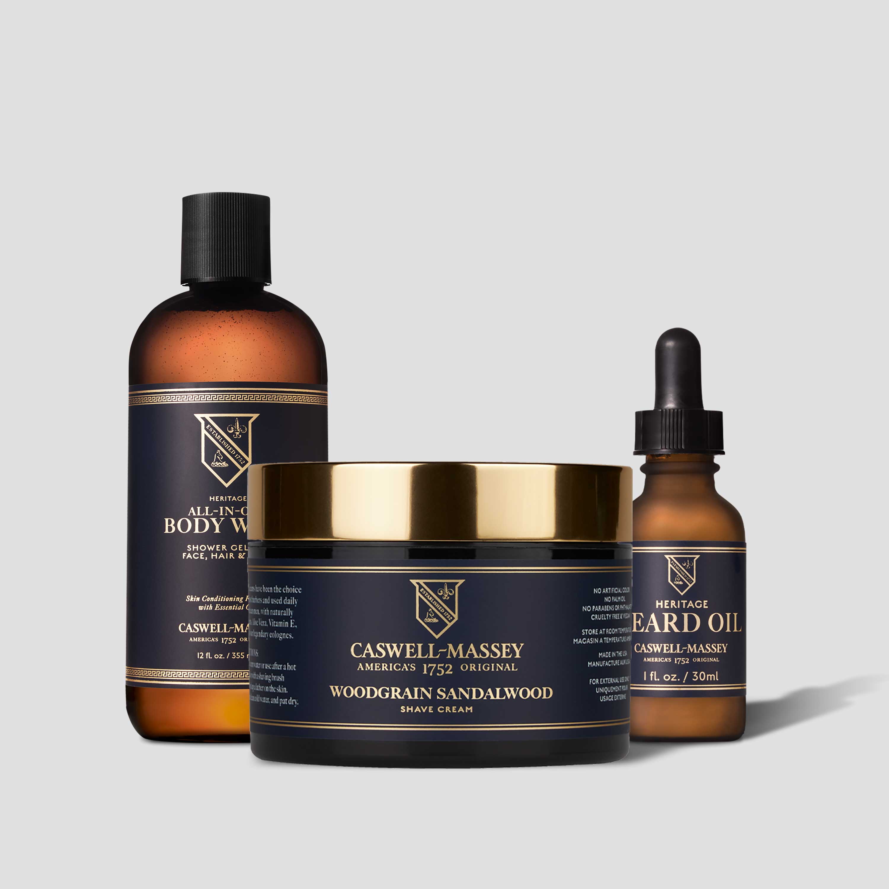 Caswell-Massey® Woodgrain Sandalwood Shave Cream, shown with Heritage All-in-One Body Wash and Heritage Face & Beard Oil