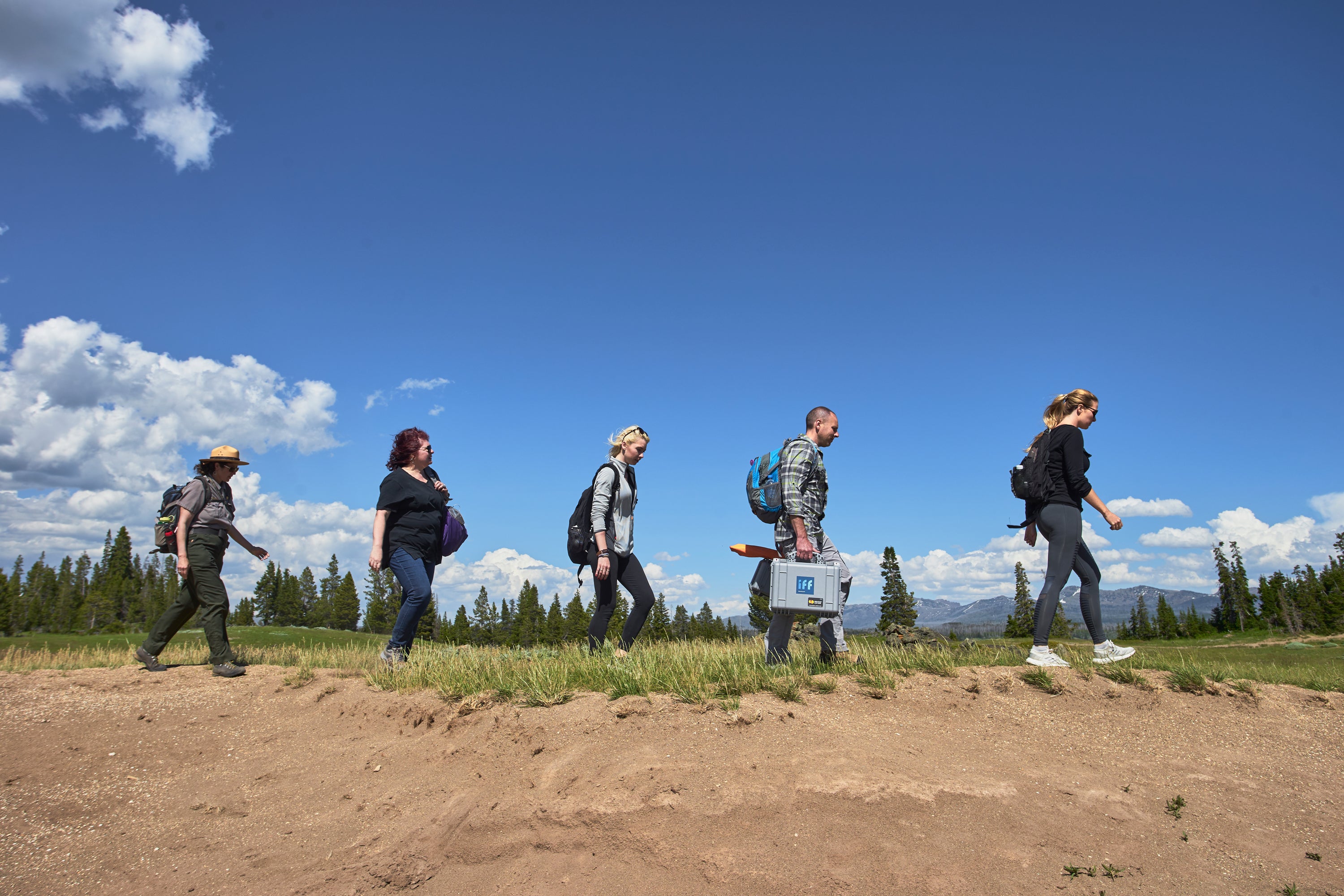 the 2019 yellowstone fragrance capture. The team of scientists and yellowstone national park rangers walking to find flowers