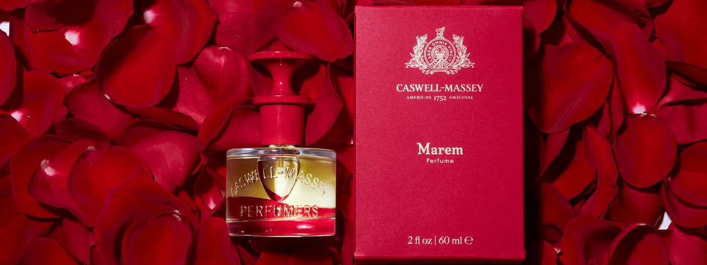 a bottle of perfume in a red box