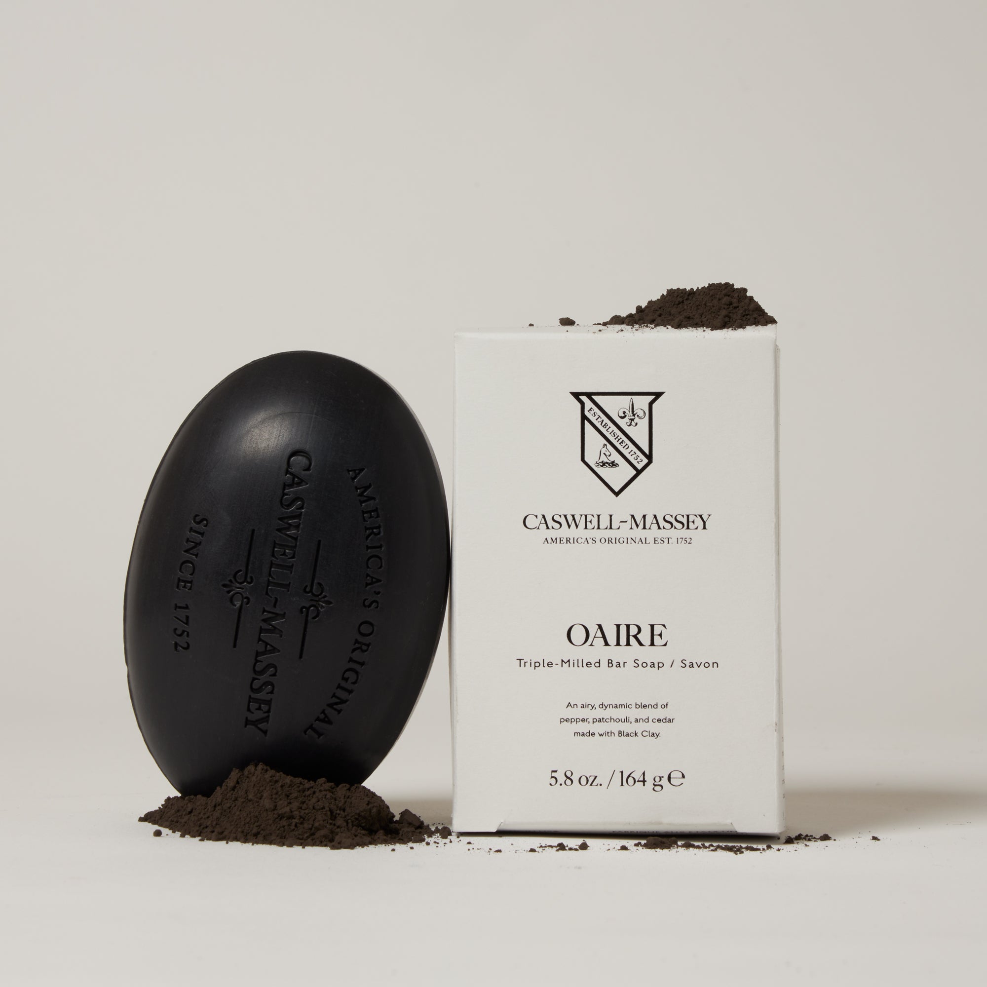 Caswell-Massey Oaire Bar Soap shown next to its outer packaging