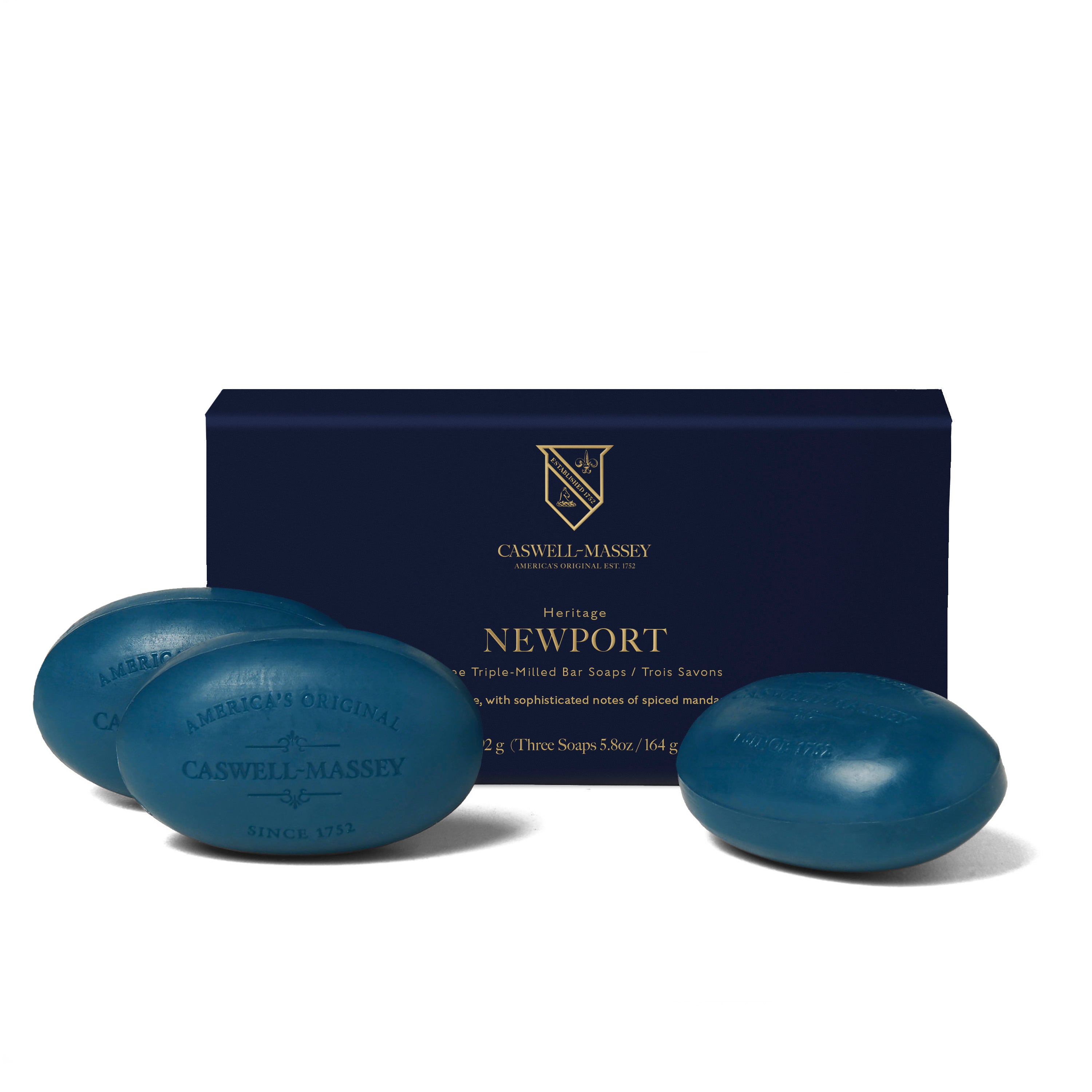 Caswell-Massey® Heritage Newport 3-Soap Set shown with navy blue gift box alongside navy blue bar soaps