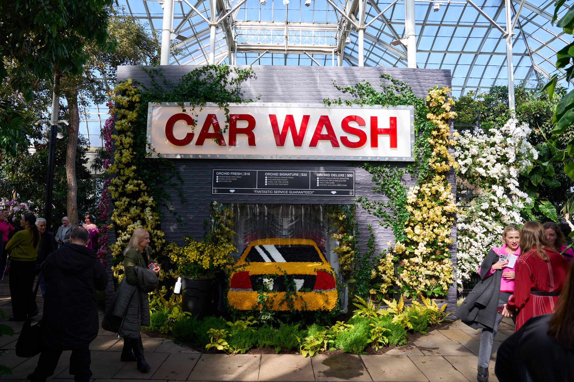 Mr Flower Fantastic's Orchid Show: Car Wash with NYC Taxi covered in orchids