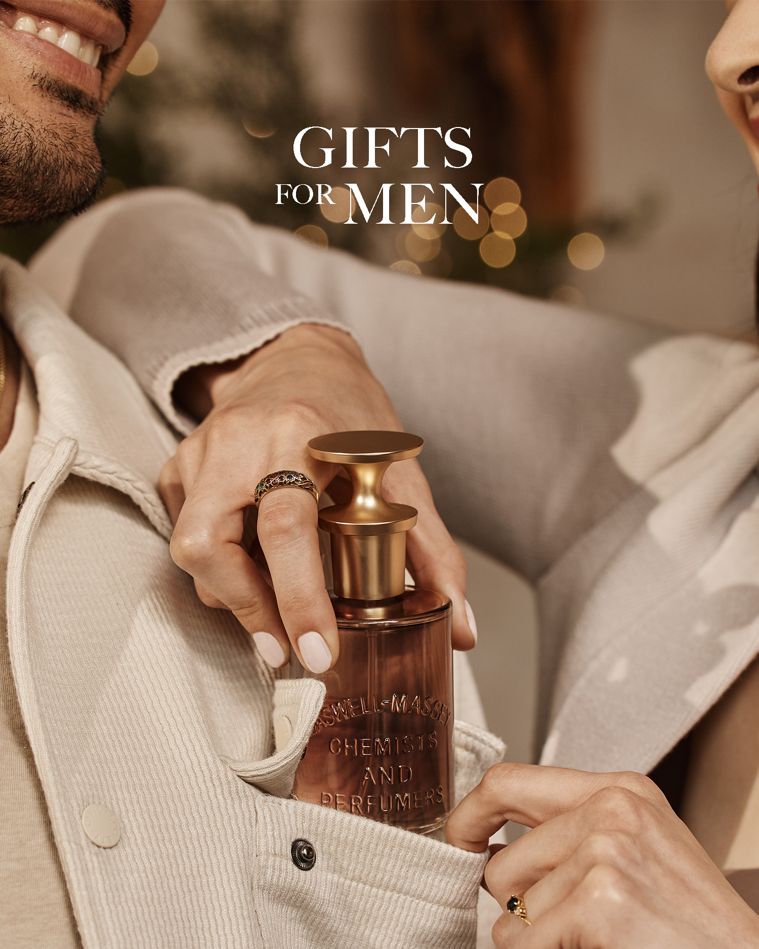 Caswell-Massey Gifts for Men: Woman gifting a man a bottle of LX48 Eau de Parfum