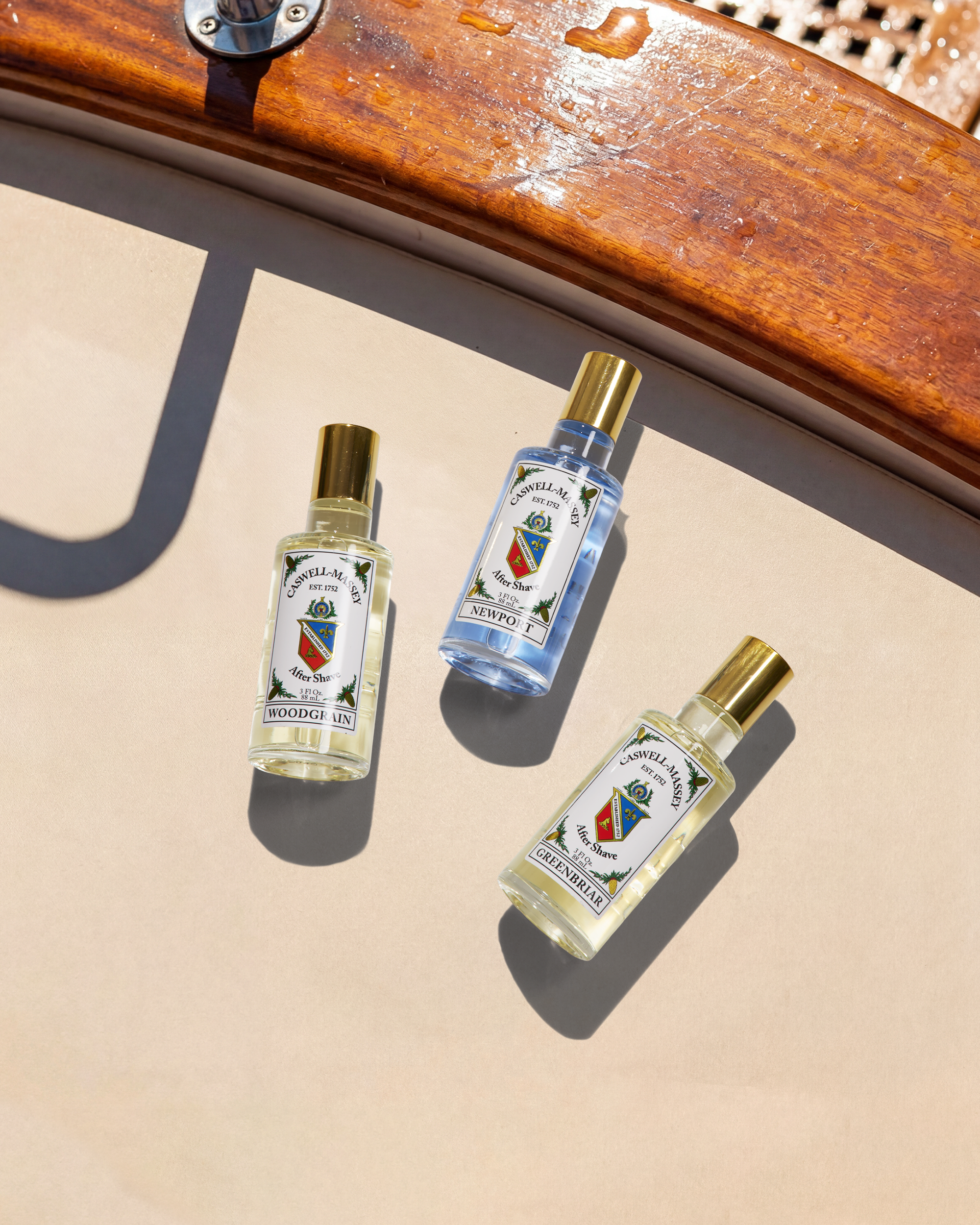 Caswell-Massey Men's Aftershaves: Image shows Woodgrain Sandalwood, Newport, and Greenbriar Aftershaves for men.