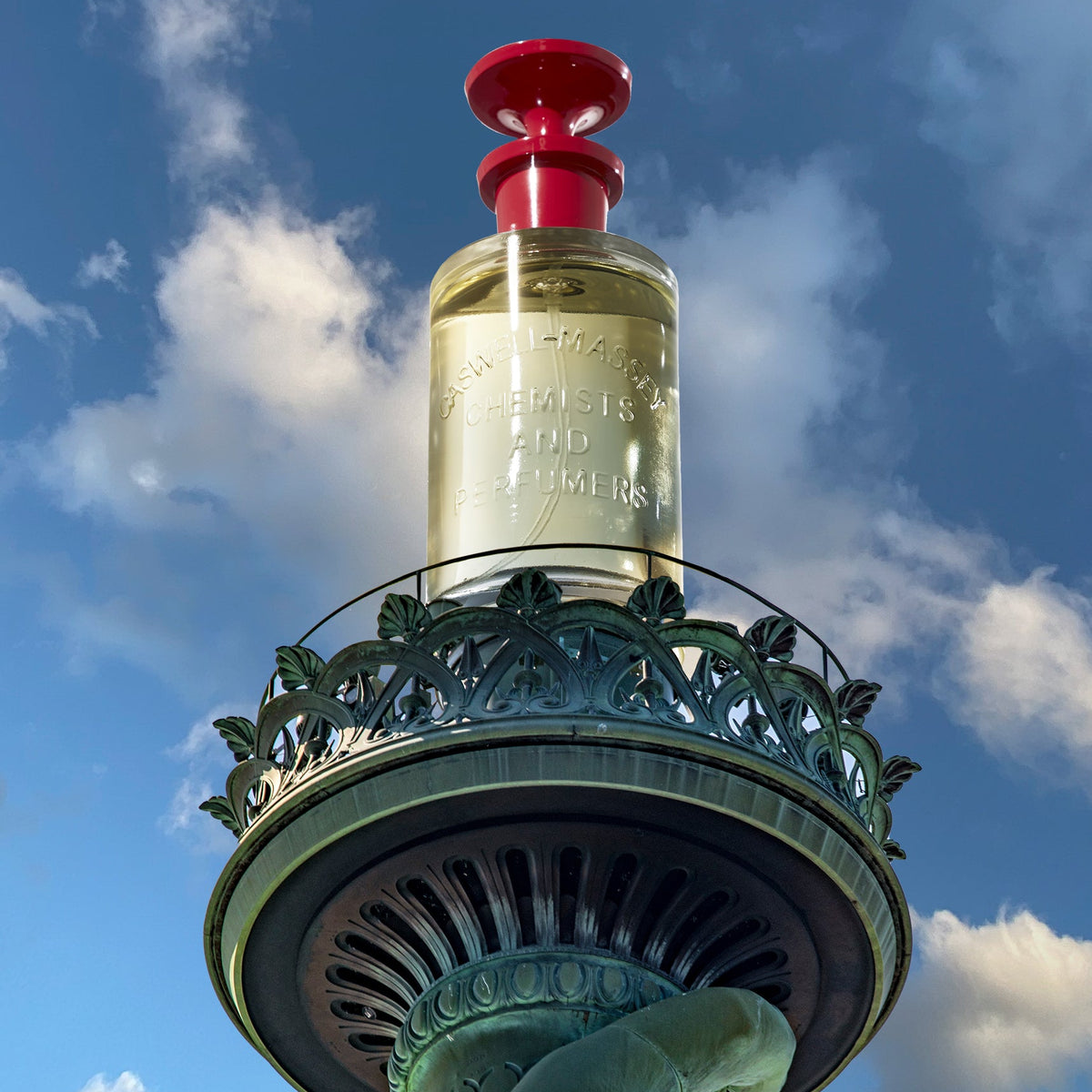Image shows Caswell-Massey Number Six Eau de Parfum bottle in place of the flame in the Statue of Liberty's hand