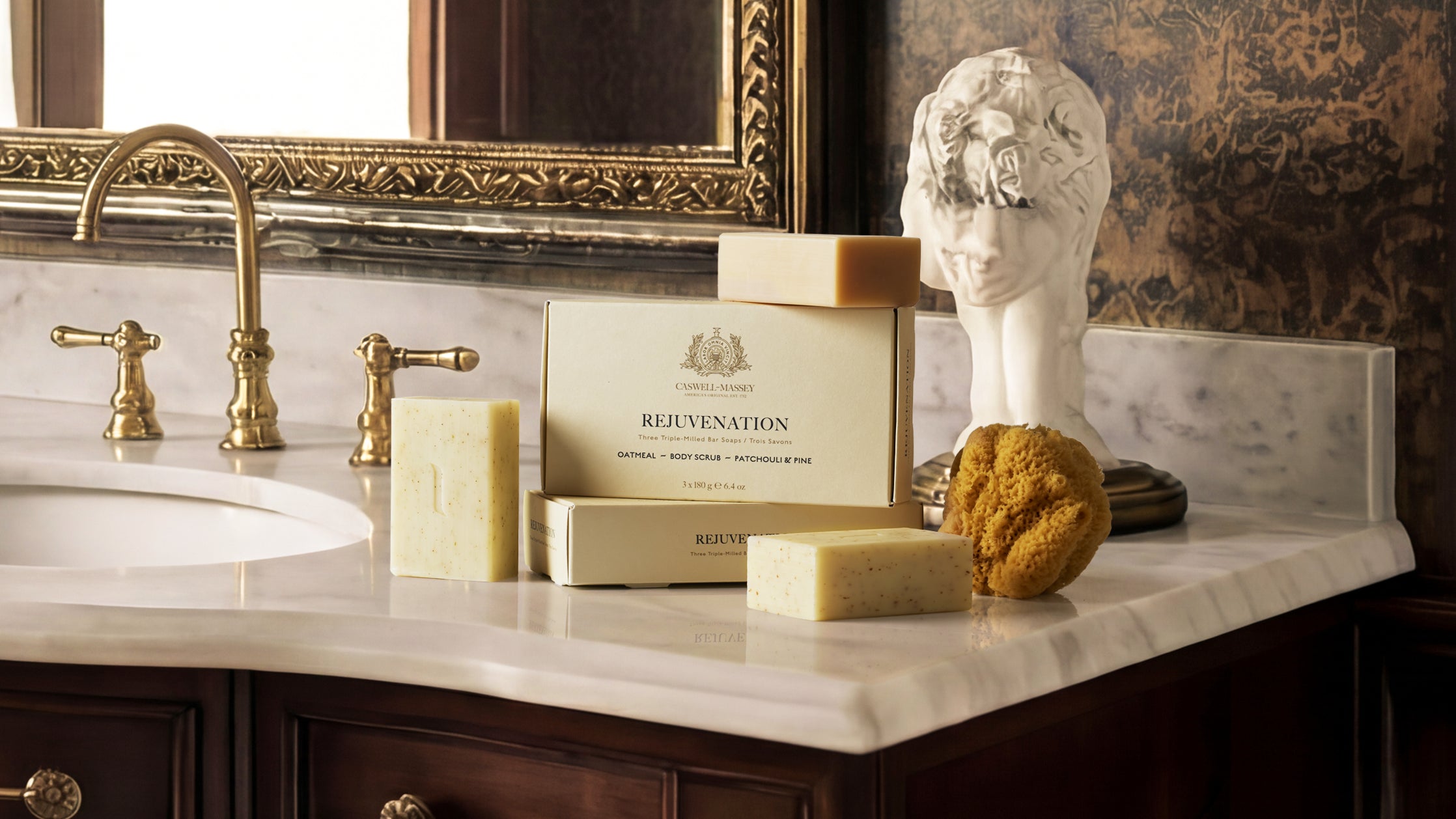 Caswell-Massey Rejuvenation Soap Set in bathroom with marble and dark woods