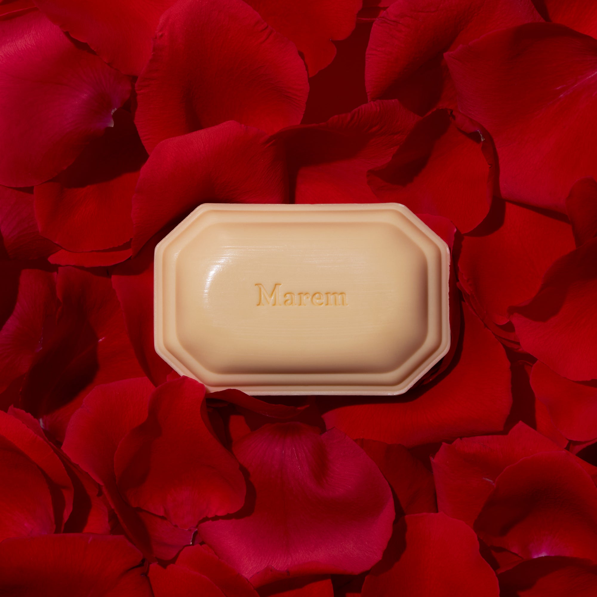 Caswell-Massey Marem Luxury Bath Soap on top of crimson red rose petals